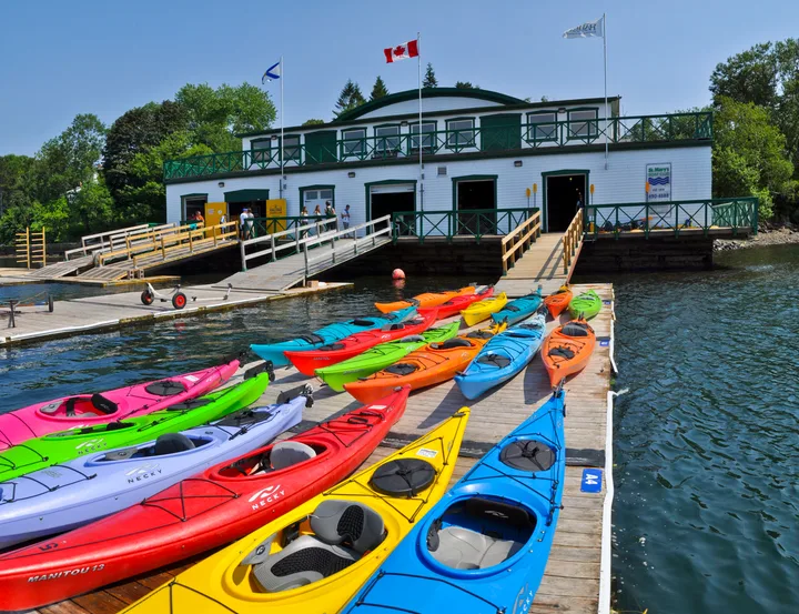 kayaks sit beside the boat launch at St. Mary's Boat Club